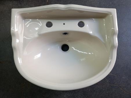 Cream coloured store wash basin
